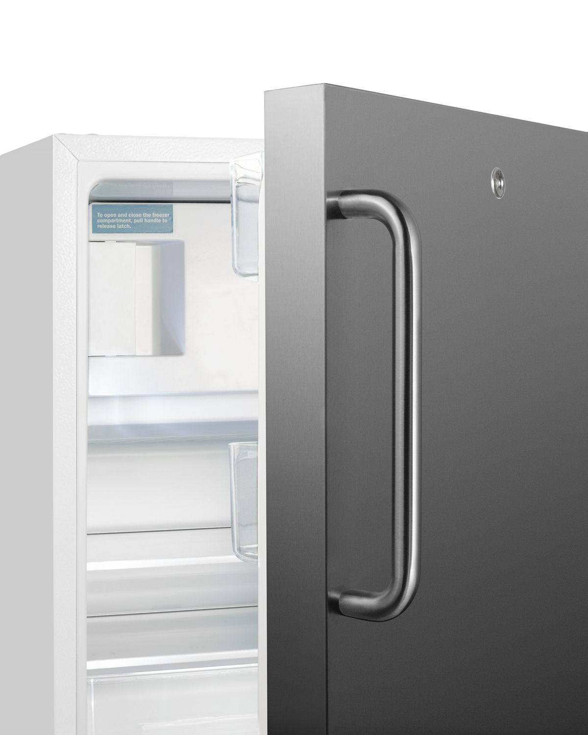 Built-in undercounter ADA compliant refrigerator-freezer in white with a reversible stainless steel door and towel bar handle, for residential use, manual defrost with glass shelves, front lock, and door storage